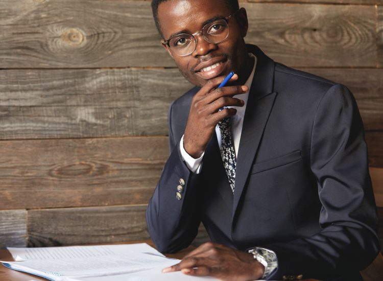 happy-african-student-formal-suit-glasses-looking-smiling